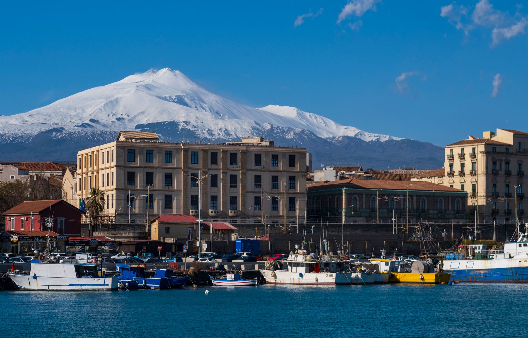 Catania harbour and city with Mount Etna in the background