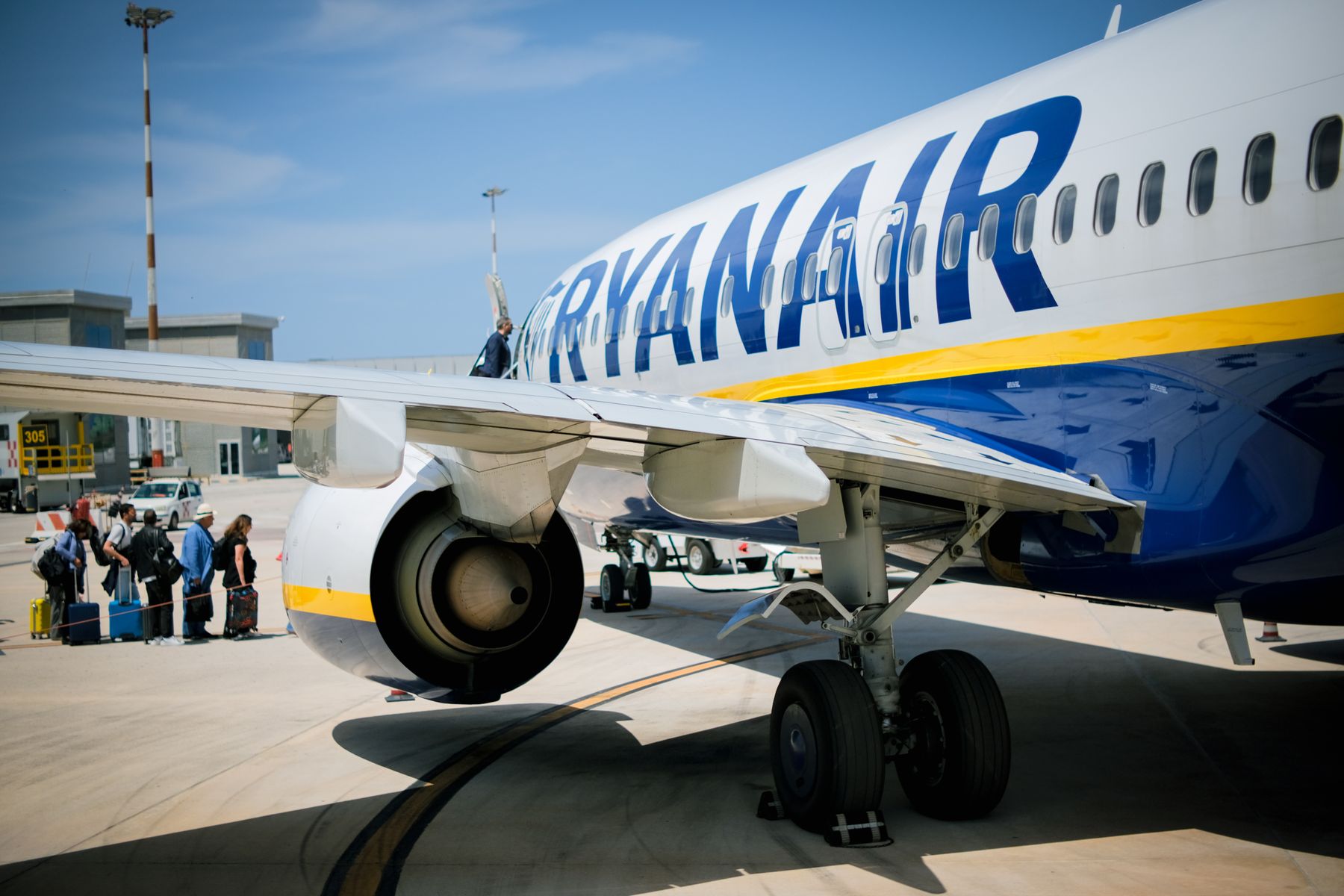 Passengers boarding an aircraft at a Sicilian airport