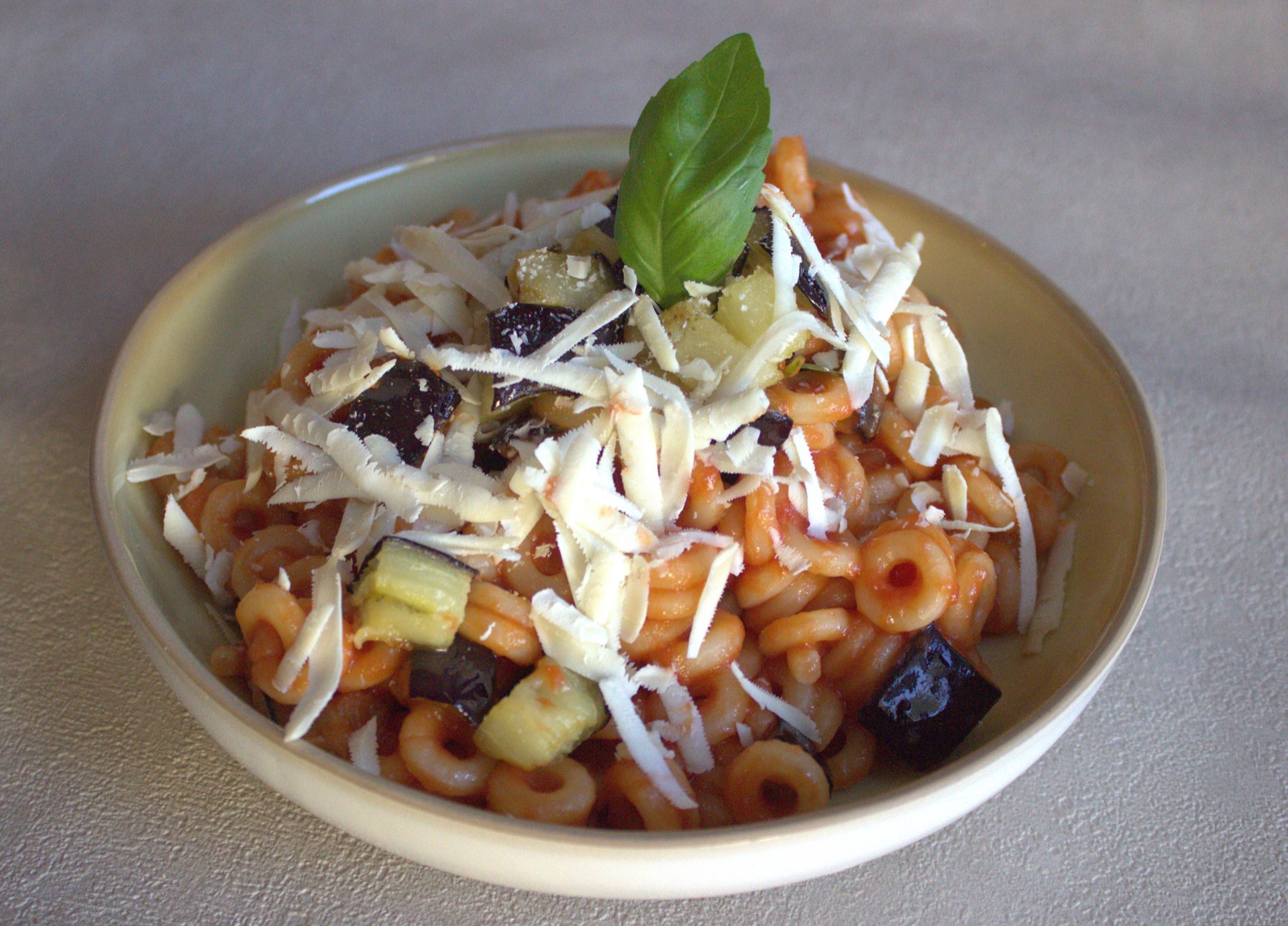 Pasta alla Norma with tomato, aubergine, basil and salted ricotta